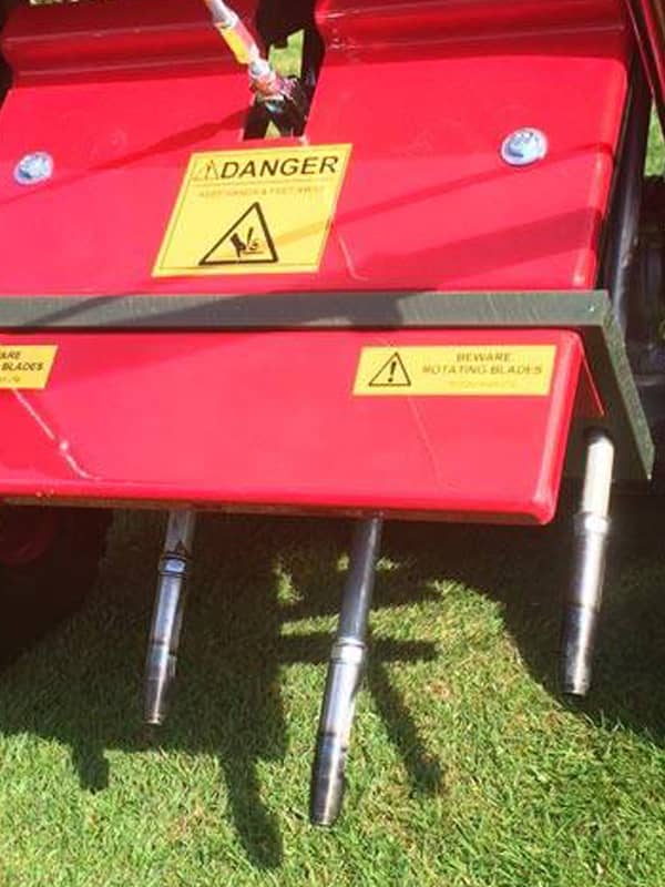 A garden fork being used on a lawn for aeration 